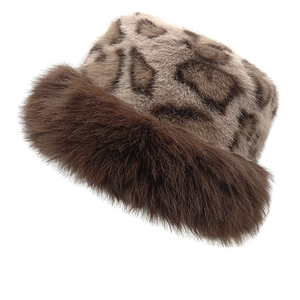 Winter leopard print faux fur bucket hat with thick brown plush trim for warm protection