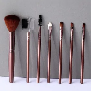 7-piece portable makeup brush set with brown synthetic bristles and rose gold handles