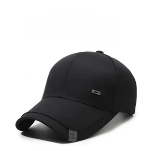Detail of black cotton baseball cap showing side metal buckle and sport fashion woven label