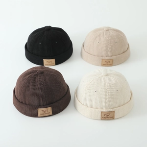Striped knit miki hats for kids featuring bear patch in black, beige, coffee, and white