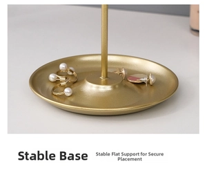 Macro detail of stable matte gold metal jewelry tray base with brushed texture