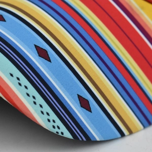 Macro detail of multi-colored geometric pattern on a woven ponytail baseball cap fabric