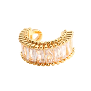 Detailed close-up of a gold-plated C-shaped ear cuff with baguette-cut cubic zirconia crystals