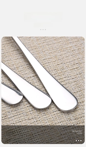 Detailed macro view of thickened stainless steel ice tongs with polished finish