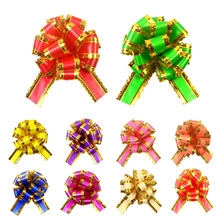 Detail of colorful 18mm gift bows with gold edges in various vibrant festive colors