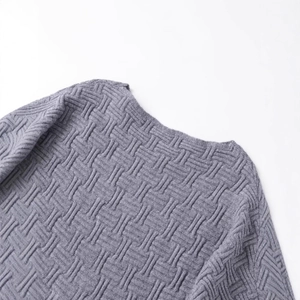 Grey off-the-shoulder knit sweater featuring an asymmetric basket-weave textured design