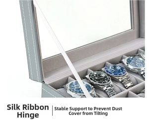 Vista de detalle del estuche para relojes de cuero gris con bisagras de cinta blanca