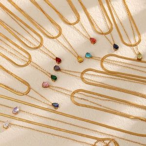 Golden double-layer necklace with pear-shaped birthstone pendant in various vibrant colors