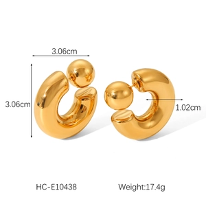Detailed view of gold C-shape ball stud earrings with 3.06cm diameter and 1.02cm width