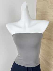 Detail of gray elastic bandeau top on mannequin showing high-stretch seamless texture