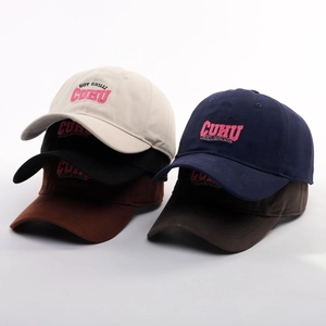 Close-up of multicolored cotton baseball caps with HOT CHILI letter embroidery
