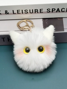 White plush owl cat keychain with yellow eyes and pink blush, featuring a gold lobster clasp