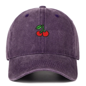 Close-up of red cherry embroidery on a purple washed denim baseball cap with retro texture