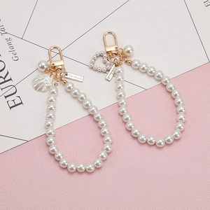 Creative pearl keychain with heart and shell charms and handmade metal tag for bags