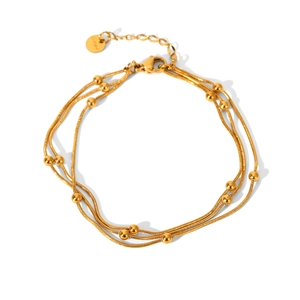 Detail of gold multi-layer bead chain bracelet with lobster clasp and extension link
