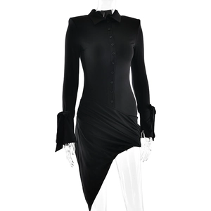 Detail view of black long sleeve dress with button-up front and waist pleats design