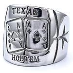 Macro detail of Texas Hold'em poker ring showing ace of spades and diamonds relief
