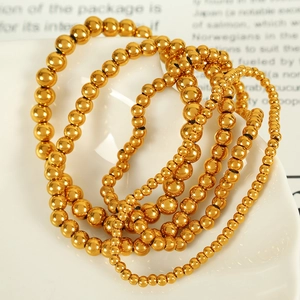 Minimalist gold beaded titanium steel bracelets set in various bead sizes for women
