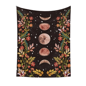 Bohemian black tapestry featuring moon phase cycles with colorful floral and butterfly patterns