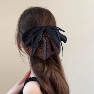 Elegant large bow hair claw with black satin and leopard print fabric layers for women