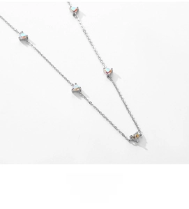 Close-up of S925 sterling silver necklace with multiple heart-shaped opal pendants