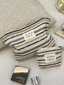 Two-piece striped canvas cosmetic bags with blue and brown patterns for travel