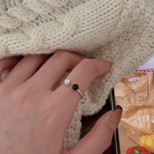 Minimalist 925 sterling silver open ring featuring a black agate bead and metal sphere