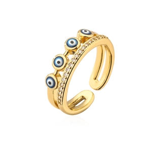 Macro detail of 18K gold-plated Evil Eye ring with zircon stones and colorful enamel