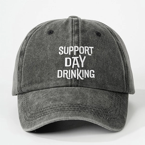 Detail of SUPPORT DAY DRINKING white embroidery on washed grey cotton baseball cap