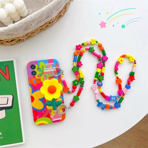 Close-up of silicone floral phone case with multi-colored long acrylic beaded crossbody strap