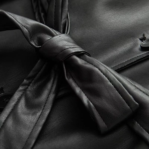 Minimalist black PU leather trench coat with waist tie belt and premium texture detail