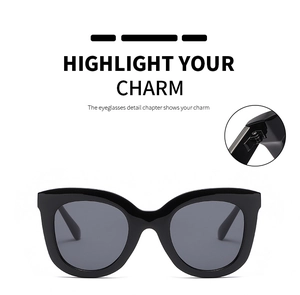 Detail of round cat-eye oversized sunglasses featuring durable metal hinge construction