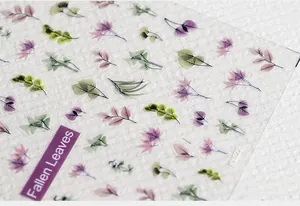Macro shot of 5D Fallen Leaves nail stickers with purple petals and green leaf details