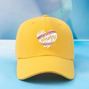 Fashionable bright yellow Mama baseball cap with heart embroidery on a blue-white background