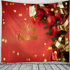 Detail of red Christmas tapestry with gold Merry Christmas text and festive ornaments