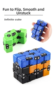 Close-up of colorful infinite cube toys showing flexible folding mechanism and matte finish