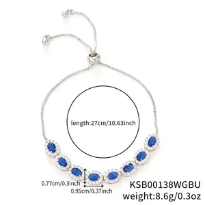 Elegant gold plated silver pull-bracelet with oval blue halo stones and zircon details