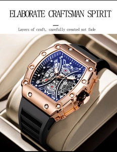 Detail of tonneau mechanical watch with rose gold case and hollow skeletal movement