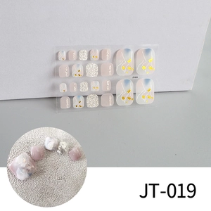 Macro detail of JT-019 marble style toe nail stickers with gold foil and glitter finish
