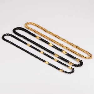 Three men's stainless steel Cuban chain necklaces in gold, black, and two-tone finishes