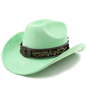 Detail of mint green suede cowboy hat featuring embroidered floral band and vintage gem buckle