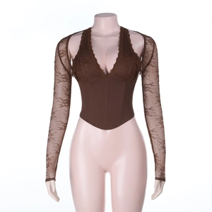 Detail view of brown lace corset top showing intricate fabric texture and slim fit design