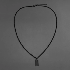Detail of a black geometric rectangular alloy pendant with minimalist military tag style