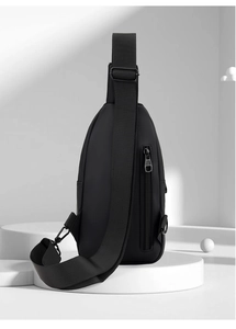 Detail of black sports chest bag featuring matte texture and high-quality metal zipper