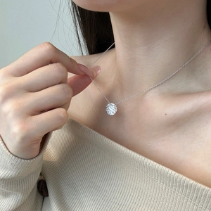 Elegant S925 sterling silver necklace with a hammered texture disk pendant on a model