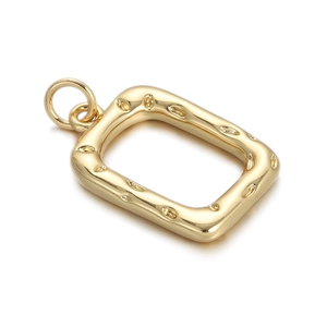 Macro view of a 18K gold-plated hollow rectangular pendant with dotted texture finish
