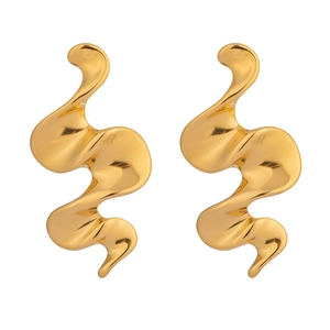 Detail of 18K gold plated spiral earrings showing a unique wave design and metallic luster