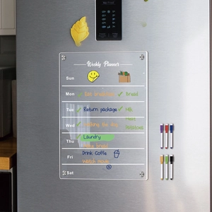 Clear magnetic acrylic weekly planner on fridge with six colorful dry erase markers
