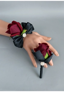 Detail of burgundy rose wrist corsage and boutonniere set with pearls and rhinestones