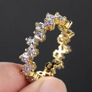 Luxurious gold-plated ring featuring square-cut sparkling cubic zirconia in a full eternity band
